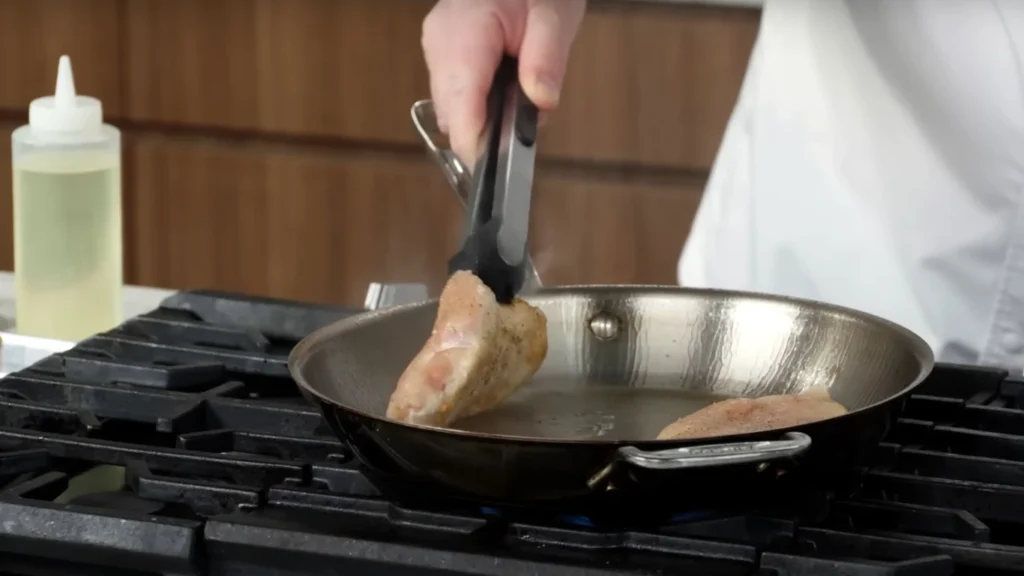 Flipping Chicken to check its cooked