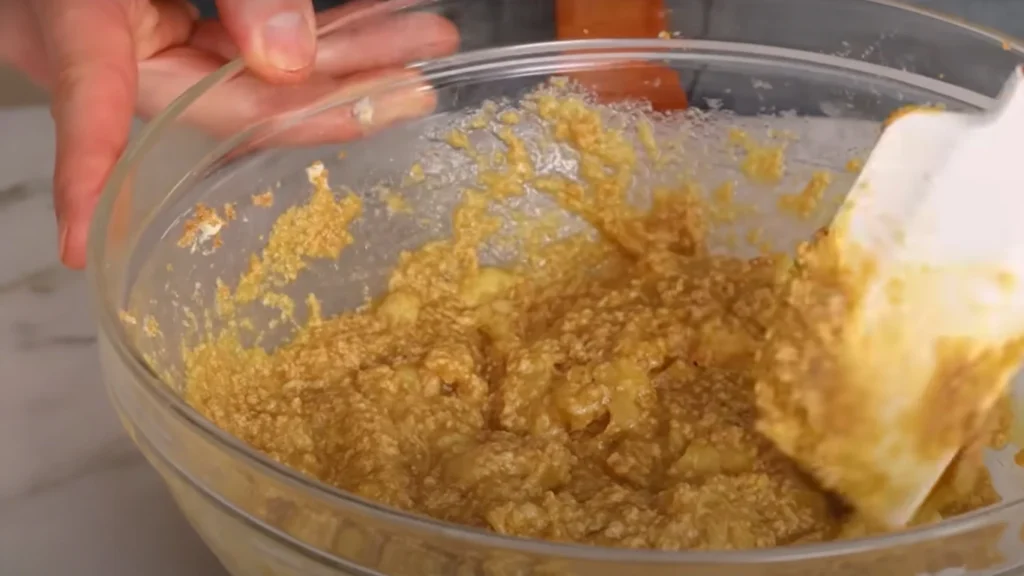 Mixing Egg and Vanilla for Banana Bread Recipe